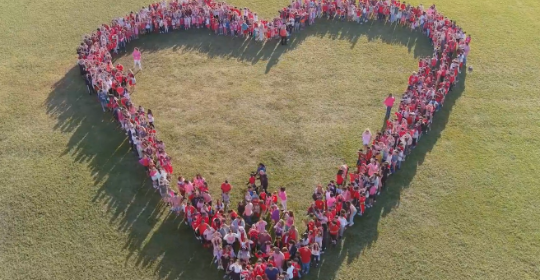 Students in the shape of heart